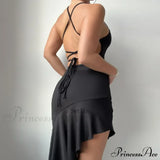 Elegante vestido midi de verano sin mangas con volantes y espalda abierta, adornado con un lazo.