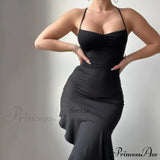 Elegante vestido midi de verano sin mangas con volantes y espalda abierta, adornado con un lazo.