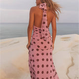 Vestido largo de lunares con espalda abierta y cintura anudada