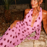 Vestido largo de lunares con espalda abierta y cintura anudada