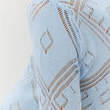 Vestido largo de punto jacquard con estampado de rombos y mangas largas