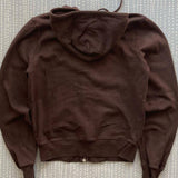 Sudadera vintage con remaches y cremallera.