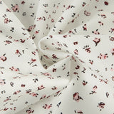 Blusa floral vintage con botones a presión y mangas abullonadas