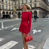 Minivestido ajustado de cintura alta con bajo anudado