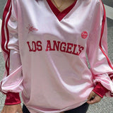 Blusa holgada de manga larga y cuello en V con estampado digital.