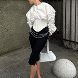 Blusa con cintura deshuesada y mangas anchas y abullonadas