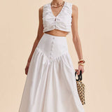 Elegante falda larga blanca con cintura alta y botones de patchwork.