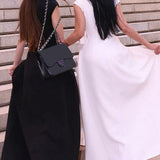 Elegante vestido liso sin mangas con cintura fruncida.