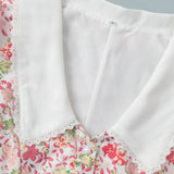 Vestido mini abotonado con cuello Peter Pan y mangas abullonadas florales