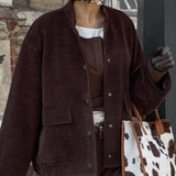 Chaqueta con cuello alto y botones de un solo pecho