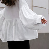 Blusa vintage con cuello bebé plisado y mangas abullonadas