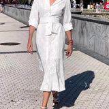 Vestido midi de cuadros, cinturón abotonado, bolsillo elegante y manga larga.