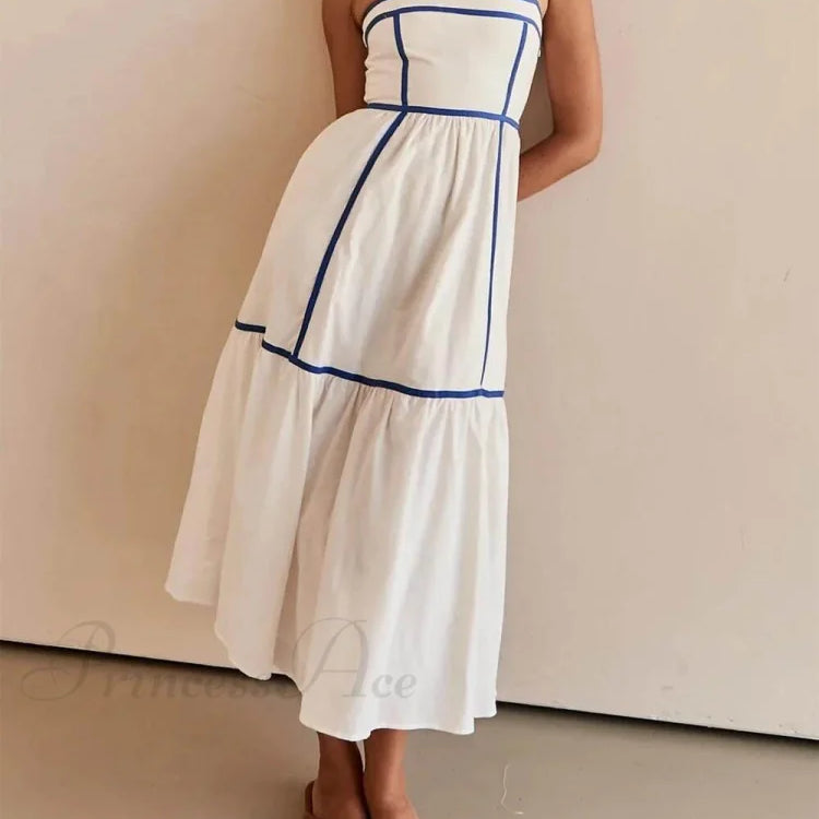 Encantador vestido midi con tirantes ajustables y ribete en contraste.