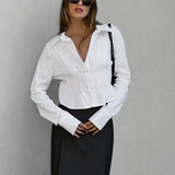 Blusa de algodón con cuello y cintura fruncidos