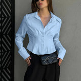 Blusa de algodón con cuello y cintura fruncidos