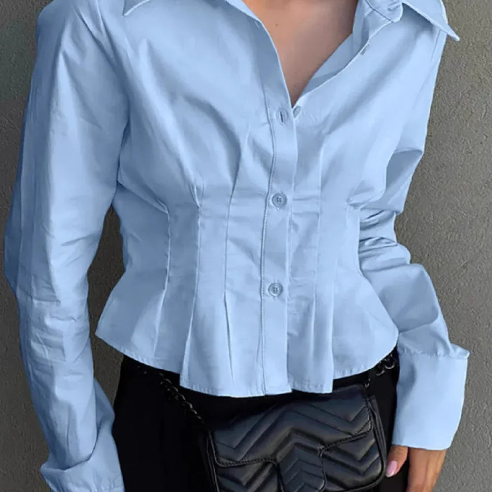 Blusa de algodón con cuello y cintura fruncidos