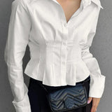 Blusa de algodón con cuello y cintura fruncidos