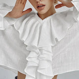 Blusa de jersey de algodón con volantes y escote en pico