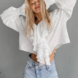 Blusa de jersey de algodón con volantes y escote en pico