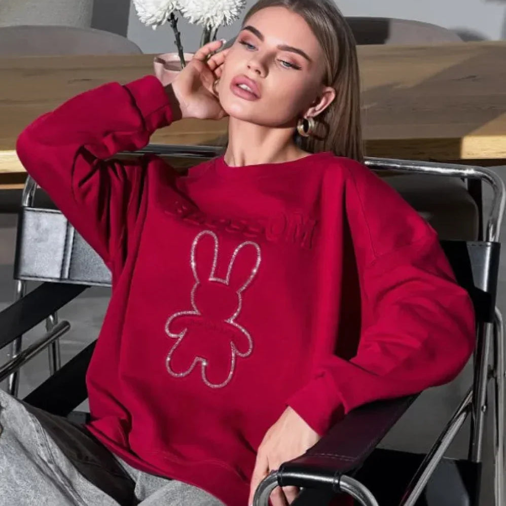 Sudadera elegante de gran tamaño con cuello redondo y motivo de conejo en relieve.
