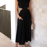 Encantador vestido midi de vacaciones con corte en la cintura y bolsillos.