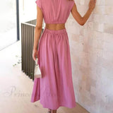 Encantador vestido midi de vacaciones con corte en la cintura y bolsillos.