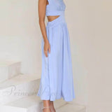 Encantador vestido midi de vacaciones con corte en la cintura y bolsillos.