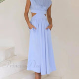 Encantador vestido midi de vacaciones con corte en la cintura y bolsillos.