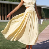 Encantador vestido midi de vacaciones con corte en la cintura y bolsillos.