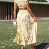 Encantador vestido midi de vacaciones con corte en la cintura y bolsillos.