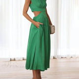Encantador vestido midi de vacaciones con corte en la cintura y bolsillos.