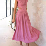Encantador vestido midi de vacaciones con corte en la cintura y bolsillos.