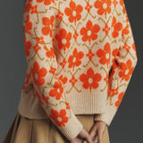Elegante cárdigan de manga larga en punto jacquard floral