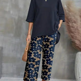 Conjunto elegante de top asimétrico y pantalón ancho con estampado floral para mujer