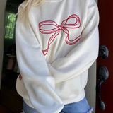 Blusa casual de cuello redondo, estilo suave y chic.