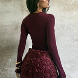 Vestido mini ajustado con mangas largas y panel floral 3D
