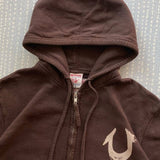 Sudadera vintage con remaches y cremallera.