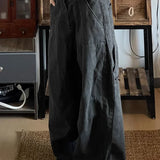 Pantalones cargo de pierna ancha en denim descolorido y desgastado