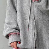 Sudadera con capucha extragrande con cremallera en color rosa descolorido