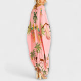 Linda - Impresionante vestido con tirantes asimétricos y estampado de palmeras