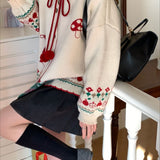 Chaleco oversize con pompones