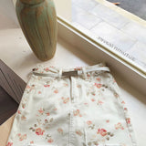 Minifalda ajustada de cintura alta en denim floral vintage
