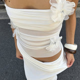Vestido largo sin espalda con recortes florales en 3D y cuello halter