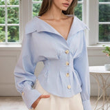 Blusa de rayas con cuello con volantes y mangas abullonadas
