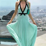 Vestido largo sexy de malla con escote pronunciado y espalda abierta con aberturas en forma de V.