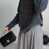 Cárdigan oversize con botones en forma de corazón y cuello redondo