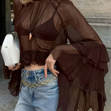 Blusa holgada de gasa con volantes y cuello redondo.