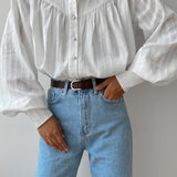 Blusa blanca de algodón jacquard con cuello alto
