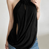 Blusa holgada y fluida con cuello halter y espalda abierta.