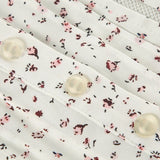 Blusa floral vintage con botones a presión y mangas abullonadas